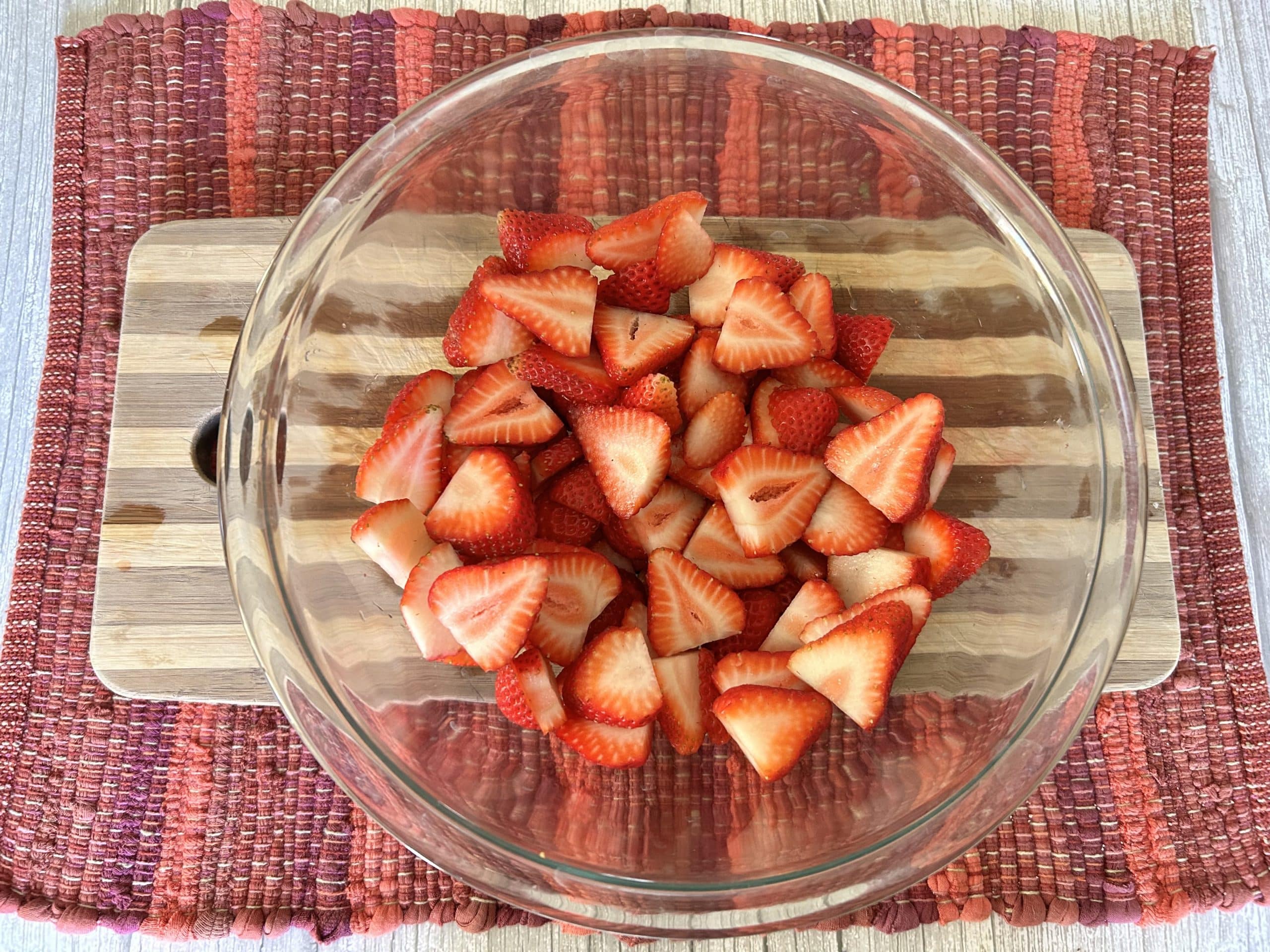 sliced strawberries in bowl