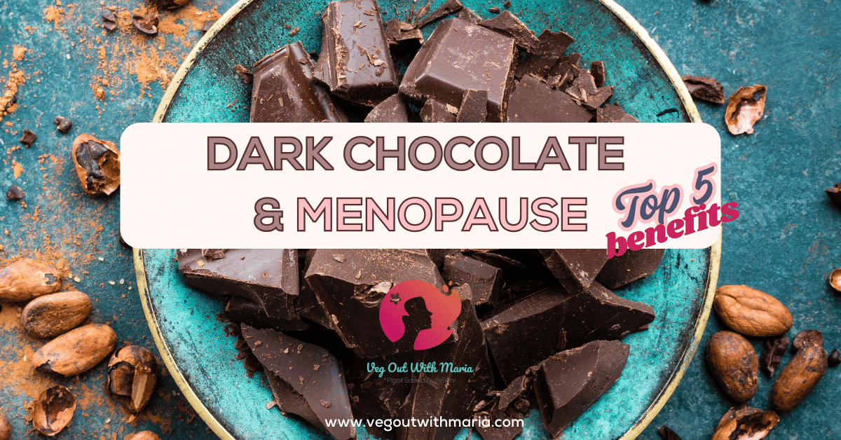 turquoise bowl full of dark chocolate with cacao beans scattered on a turquoise table. Dark Chocolate and Menopause: Top 5 Benefits. Veg Out With Maria