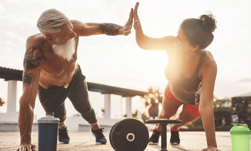 fitness couple doing pushups together outdoor exercise